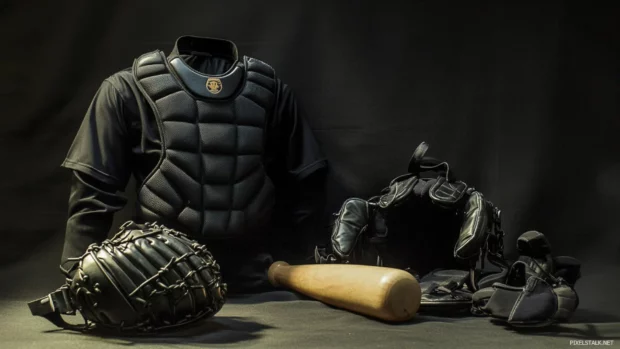Baseball next to umpire gear before the game begins.