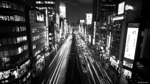 Black city veins lit up by fast traffic flows.