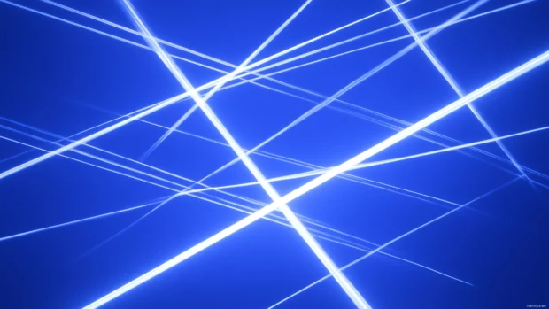 Blue sky vibrancy, crisscrossing jet trails form geometric patterns.