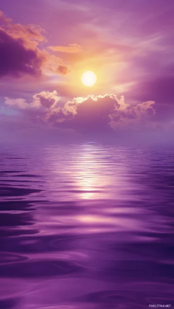 Breathtaking purple sky with a golden sun peeking through the clouds.
