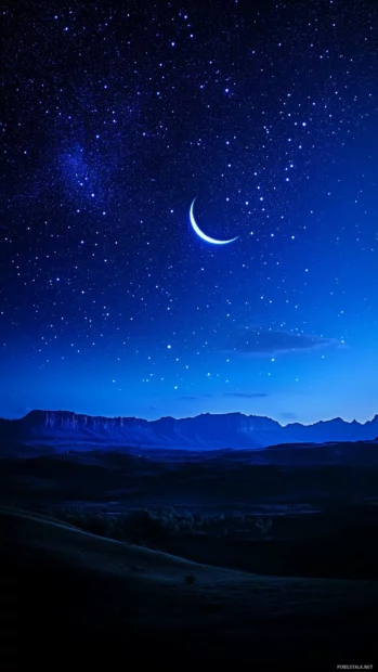 Bright crescent moon serene night sky twinkling stars deep indigo backdrop.