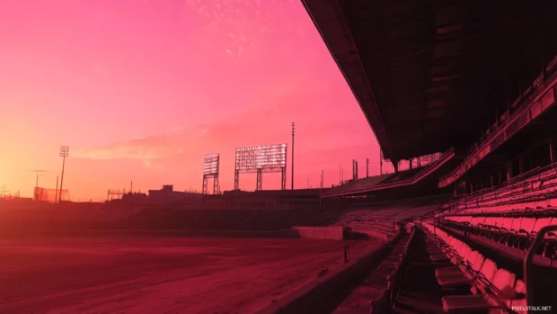 Cinematic view of a stadium under a pink orange sky enhanced by Baseball bat silhouette sunset.
