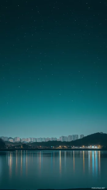 City skyline peaceful night sky stars shining brightly faint glow urban lights.