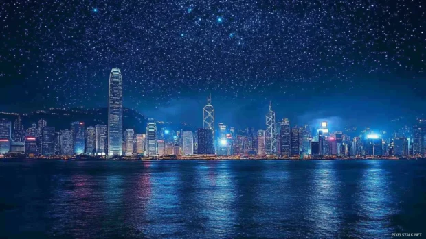 Elegant skyline in city nights wallpaper for PC, filled with stars above.