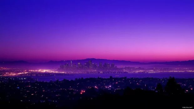 From afar, the dark city looms under a violet twilight, evoking a sense of wonder.