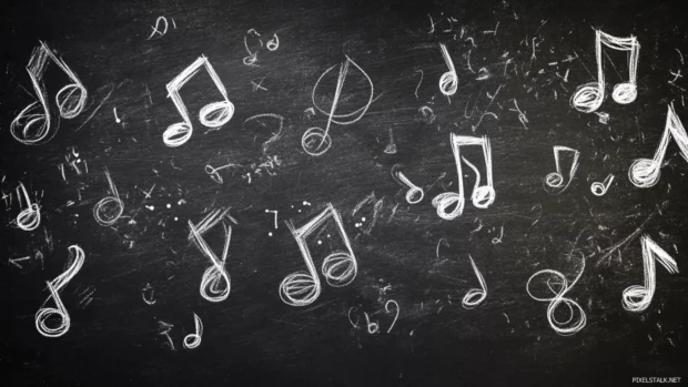 Music notes drawn in glowing white chalk on blackboard.