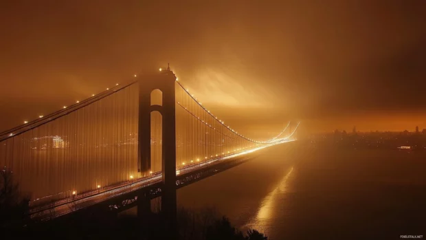 New York City bridges stretch under glowing skies.