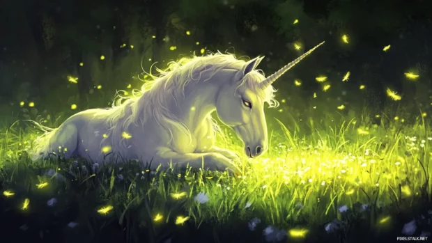 Pastel fireflies drift around a unicorn lying in grass.