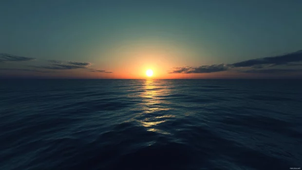 Peaceful ocean horizon glowing in a Sunrise Wallpaper for Desktop.