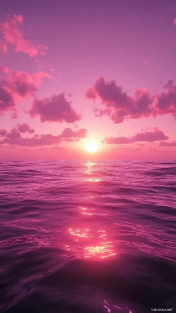 Pink purple sky, ocean reflects, soft sunset light fades away.