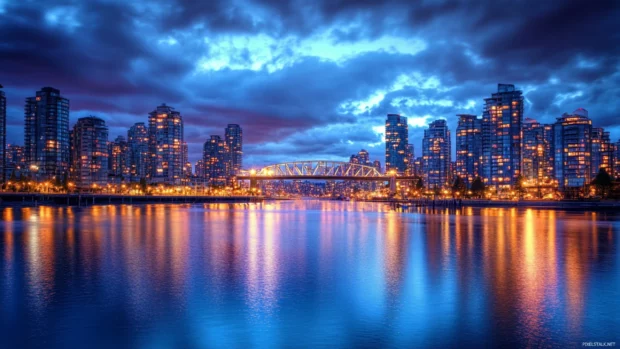 Reflections shimmer across the river in the Nighttime City Desktop Wallpaper.