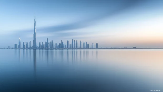 Simple image of Dubai skyline, futuristic skyscraper designs, tranquil sky.