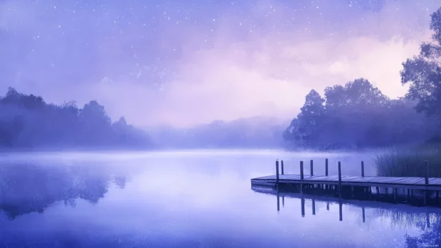 Sky painted soft purples and blues tranquil evening scene calm lake stars begin to twinkle.