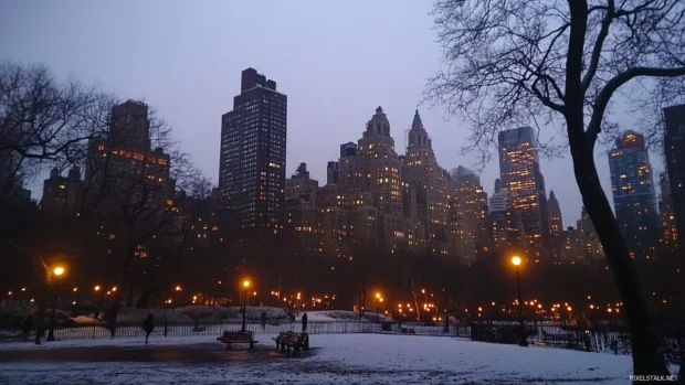 Soft glow surrounds the skyline in this New York City night scene.