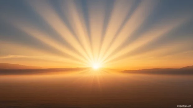 Sunrise beams streak through dry desert haze.