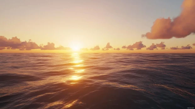 Sunrise warms the horizon over the vast ocean expanse.