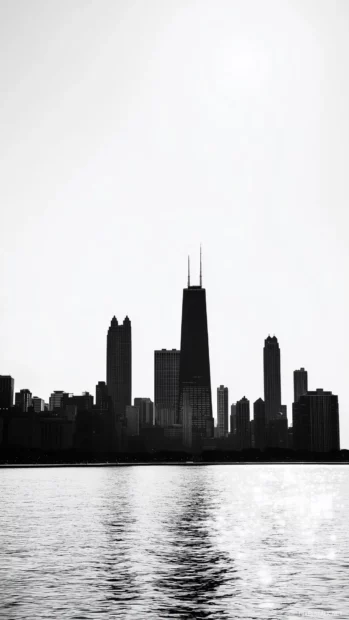 The Chicago skyline in minimalism, featuring the Willis Tower as a silhouette against a clear sky.
