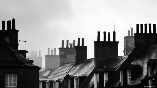 Urban rooftops silhouetted against the sky in black and white city wallpaper.