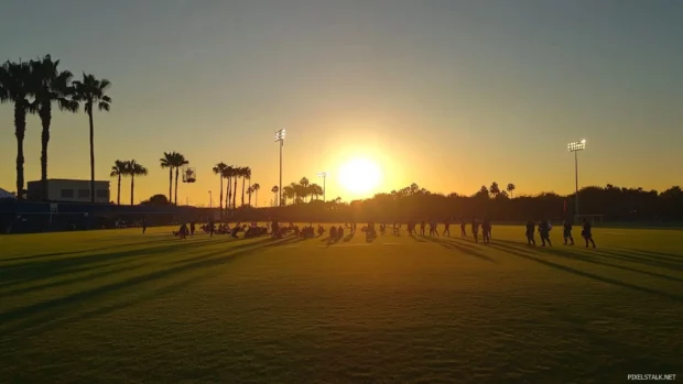 Wide shot of practice session at sunset.