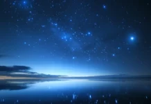 A celestial dream Beautiful blue stars sky wallpaper, with stars spilling across the deep space horizon.