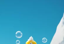 A cheerful Rubber Duck wallpaper showing the duck popping out of a bubble mountain.