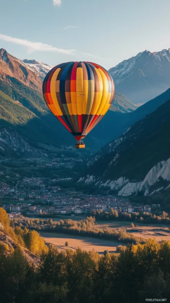 A colorful hot air balloon drifting over a scenic valley, with a radiant sunrise creating a golden glow.