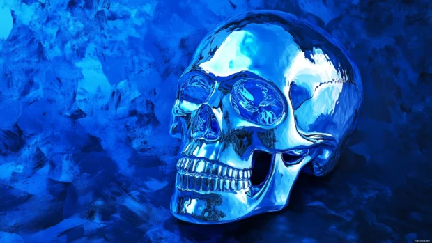 A detailed blue skull with metallic textures, illuminated by soft blue and silver lighting, set against a dark, grungy background.