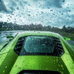 A green Lamborghini powers through raindrops that streak across the windshield with dramatic sky.