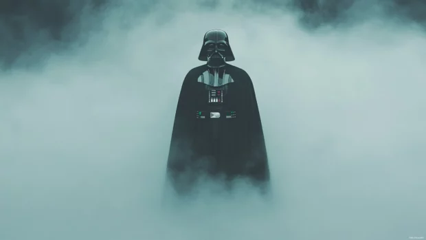 A moody depiction of Darth Vader standing in the mist, ideal for those seeking cinematic Star Wars backgrounds.