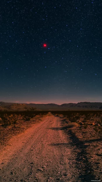 A red star humming over forgotten desert trails.