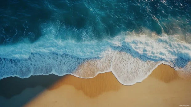 A tranquil beach scene with gentle waves, great for Windows 10 desktop lock screen.