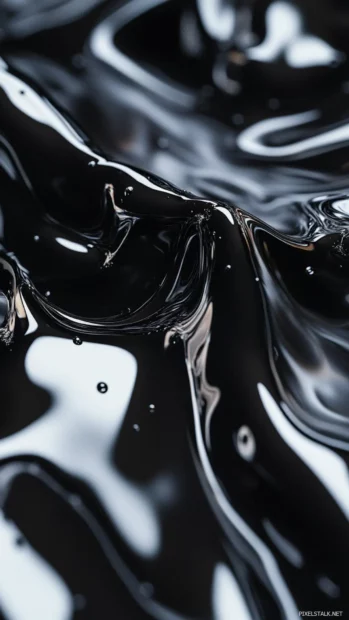 Abstract black liquid ripples forming sharp edgy patterns.