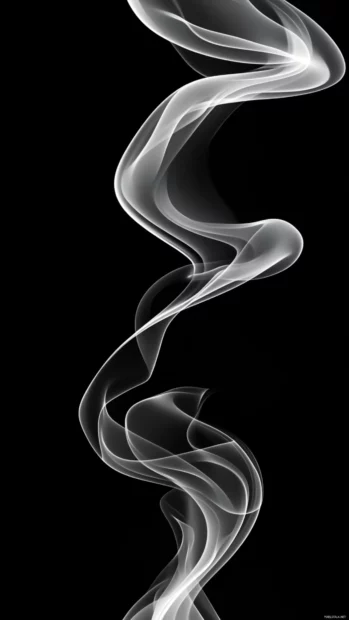 Abstract black smoke swirling over a jet black canvas.