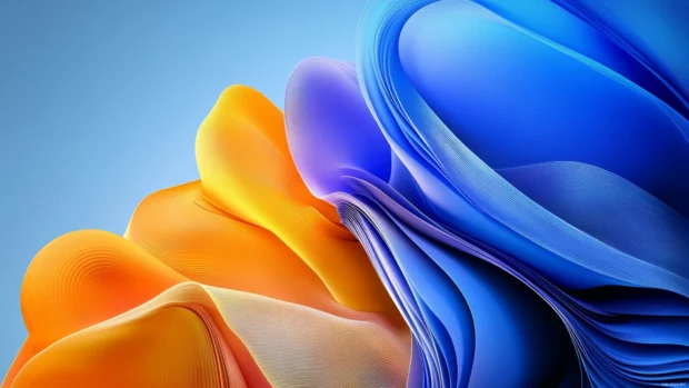 Abstract ribbons and light waves in a Windows 11 desktop lock screen wallpaper.