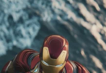 Aerial view of Iron Man flying over the ocean.