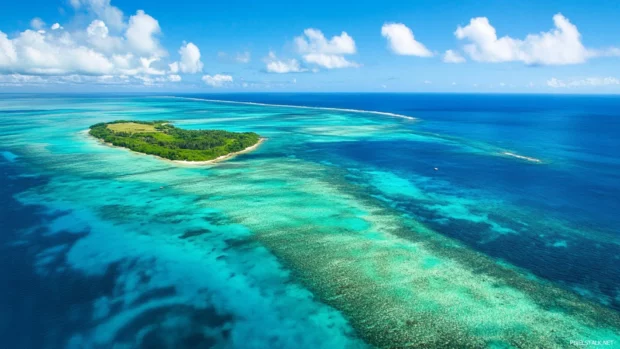 Aerial view of vibrant ocean blues and greens, one of the top ocean views for PC backgrounds.