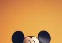 Against a pastel orange backdrop, Cute Mickey Mouse waves both hands happily.
