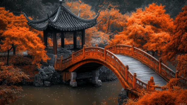 An old wooden bridge surrounded by orange foliage, found in nature inspired Fall PC Wallpapers.