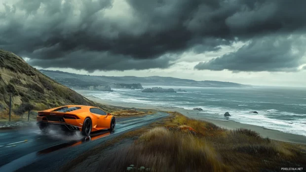An orange Lamborghini Huracan speeds along a coastal cliff edge under a dramatic sky.