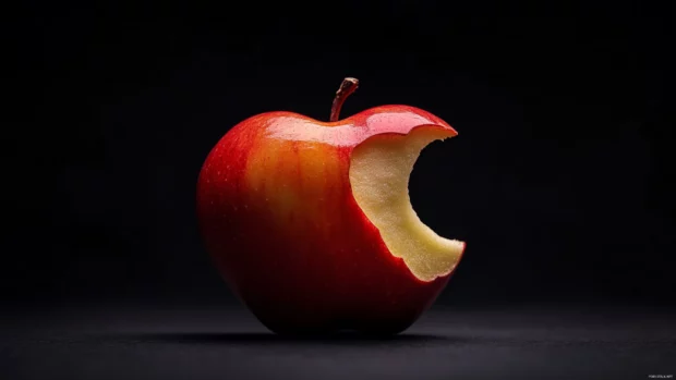 Apple Desktop Wallpaper featuring iconic bitten apple shape on a minimalist dark backdrop.
