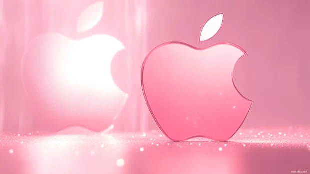 Apple logo glowing beautifully on a soft pink background with subtle sparkles.