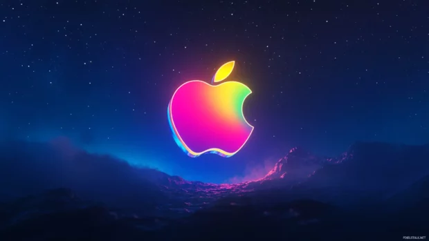 Apple wallpaper highlighting a glowing rainbow logo over a starry sky.