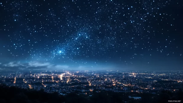 Beautiful stars wallpaper featuring stars floating above glowing city lights.