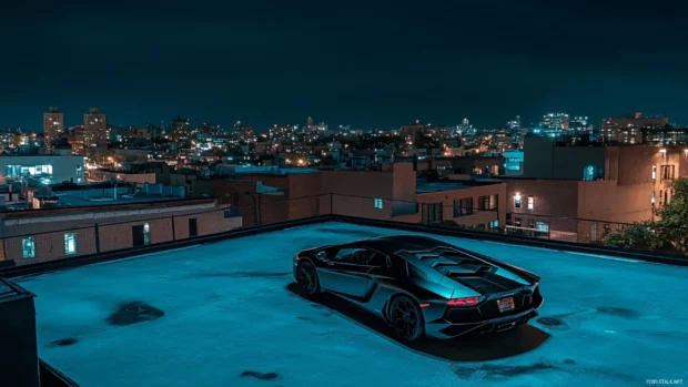 Black Lamborghini wallpaper featuring a matte black Aventador parked on a rooftop at night.