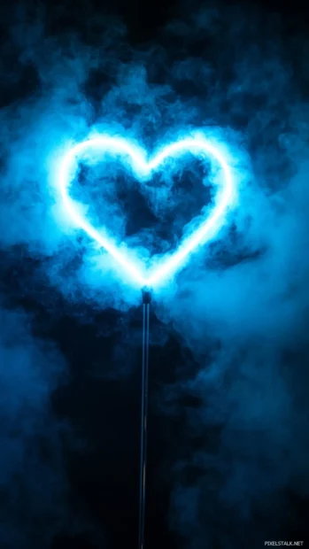 Blue neon heart floating against night mist.