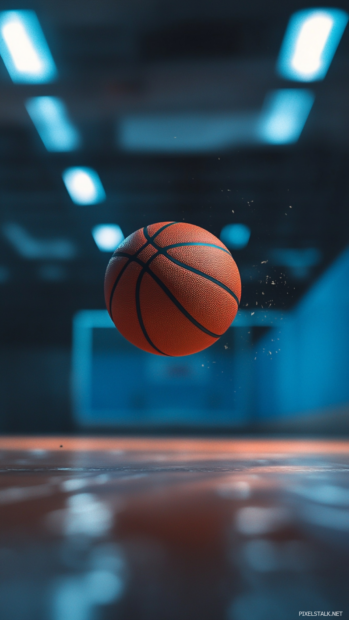 Cool Basketball iPhone Wallpapers showcasing a close up of spinning ball in mid air, cinematic lighting.