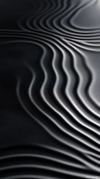 Dark water ripples creating soft motion across black surface.