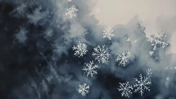 Delicate snowflakes falling against a soft gray watercolor sky.