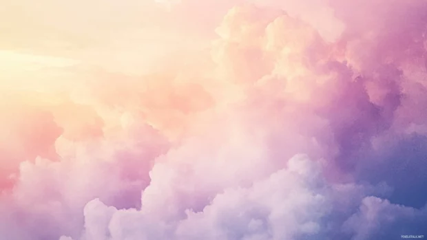 Delicate watercolor clouds fading into twilight shadows.