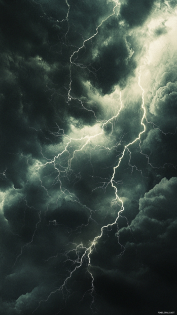 Electric lightning veins cracking through black clouds.